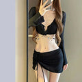 Women's long sleeve black and white bikini swimsuit for swimming.