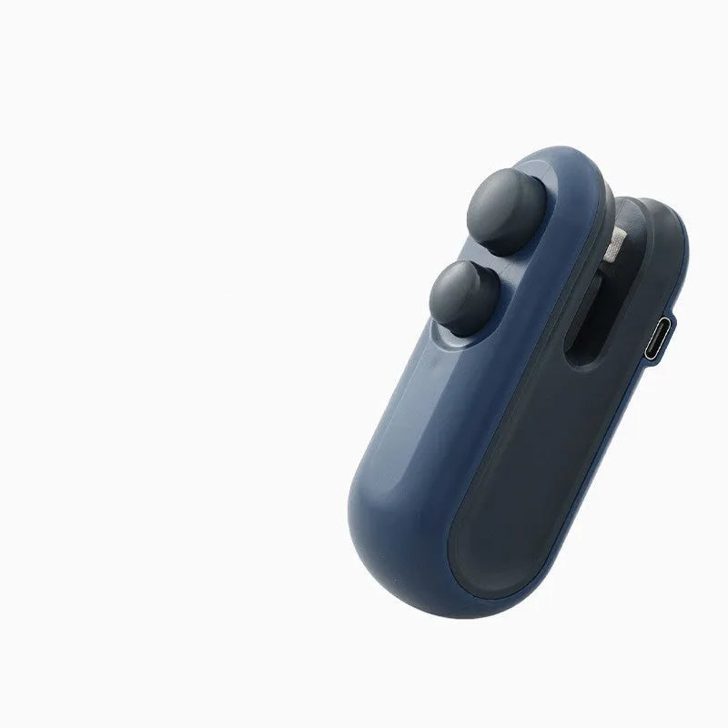 Blue and white handheld USB rechargeable heat sealer with magnetic back on a metal surface.