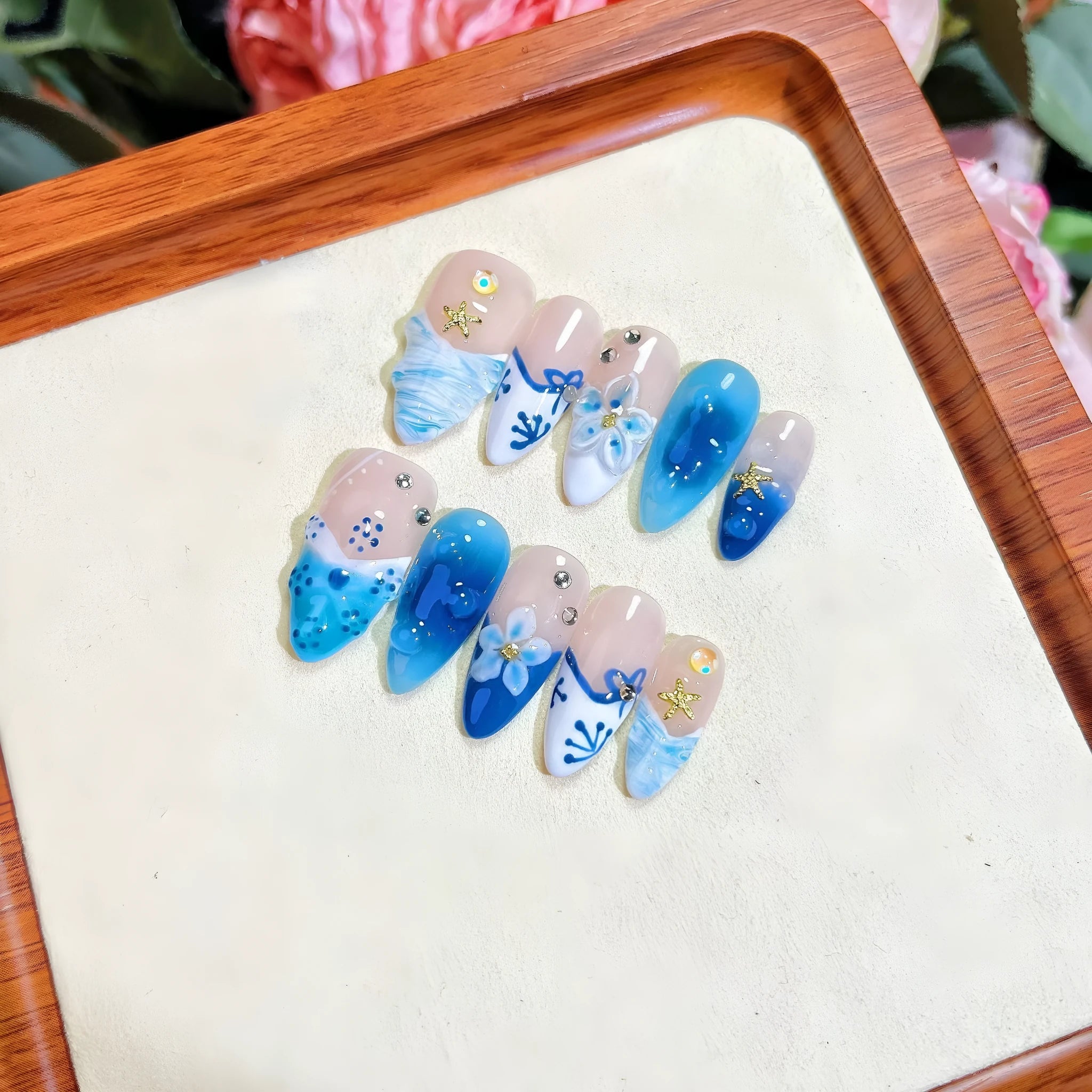 Blue hand-painted false nails with carved summer ice transparent design in sizes XS to L