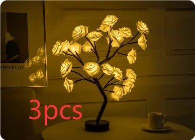 White and red rose flower LED table lamp with bonsai tree lights on a table.