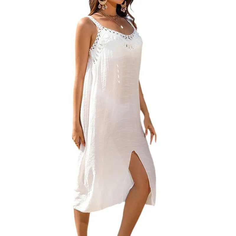 White crochet beach dress with removable suspenders, V-neckline, and bottom slit