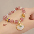Women's geometric bracelet in choice of gray jade or strawberry quartz with ethnic metal decorations