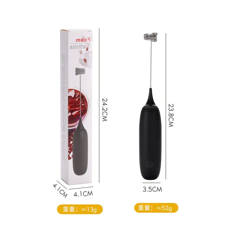 Black and white electric hand-held milk frother and blender for coffee beverages