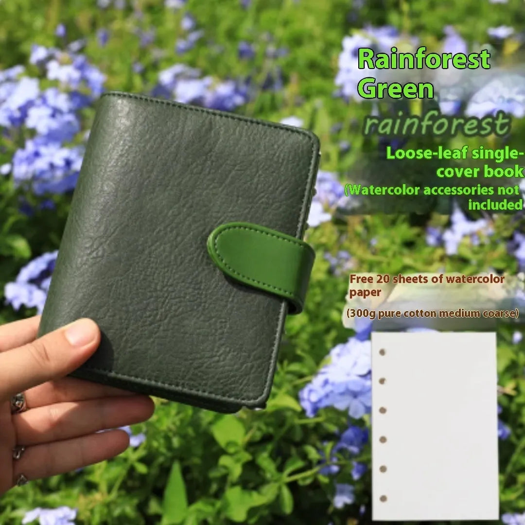 A7 size loose-leaf watercolour sketchbook in avocado green, showing miniature dimensions and removable pages.