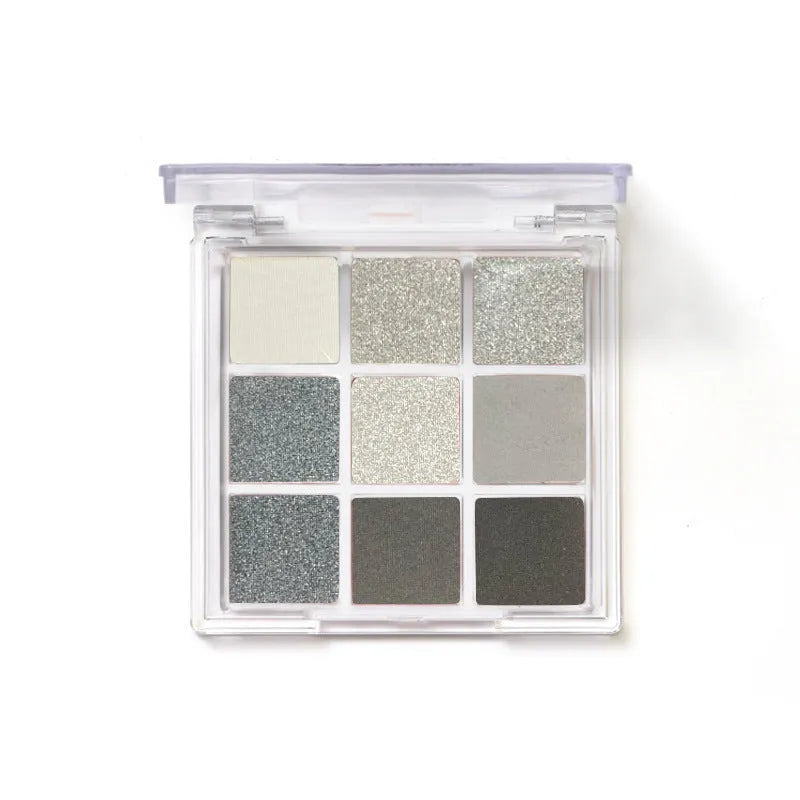 Smoked nine-colour eye shadow palette showing white, silver, black, and iron grey shades