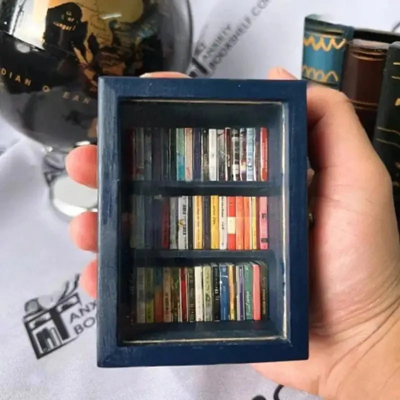 Mini wooden bookshelf with 60 mini books, 10x8x5cm, on a desk as stress relief decor