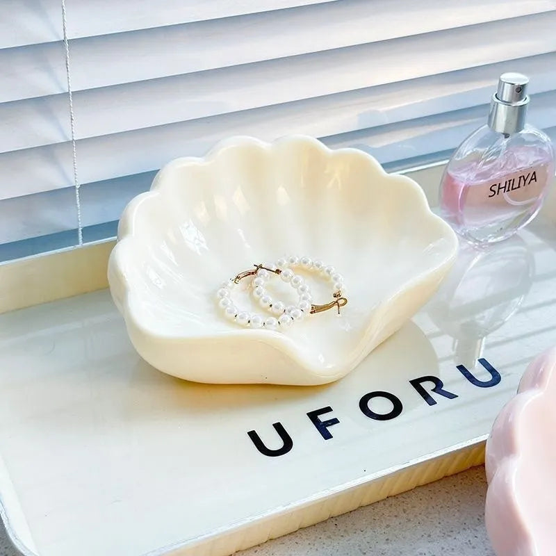 Shell-shaped plastic soap dish in pearl white or cherry blossom pink for bathroom storage