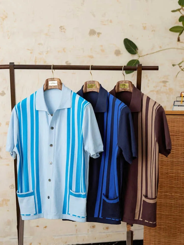 Cotton striped short sleeve knitted cardigan polo shirt on a hanger showing lapel collar.