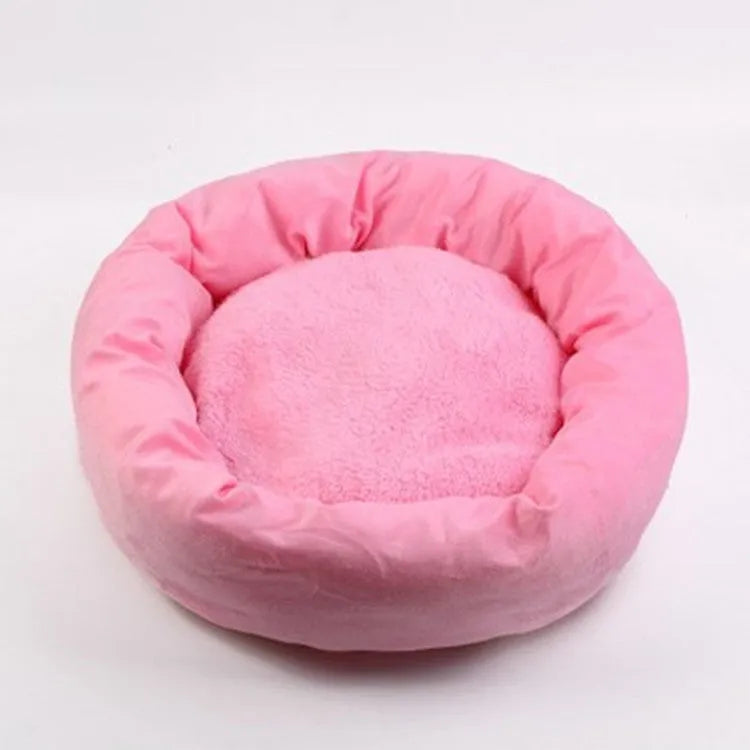 Light grey cotton-filled dog bed showing rounded shape and soft padding, with optional pillow beside it