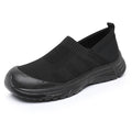Women's black slip-on shoes with cloth upper and PVC sole showing one pedal design