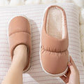 Winter indoor slippers with artificial leather upper, rubber anti-slip sole, and plush lining