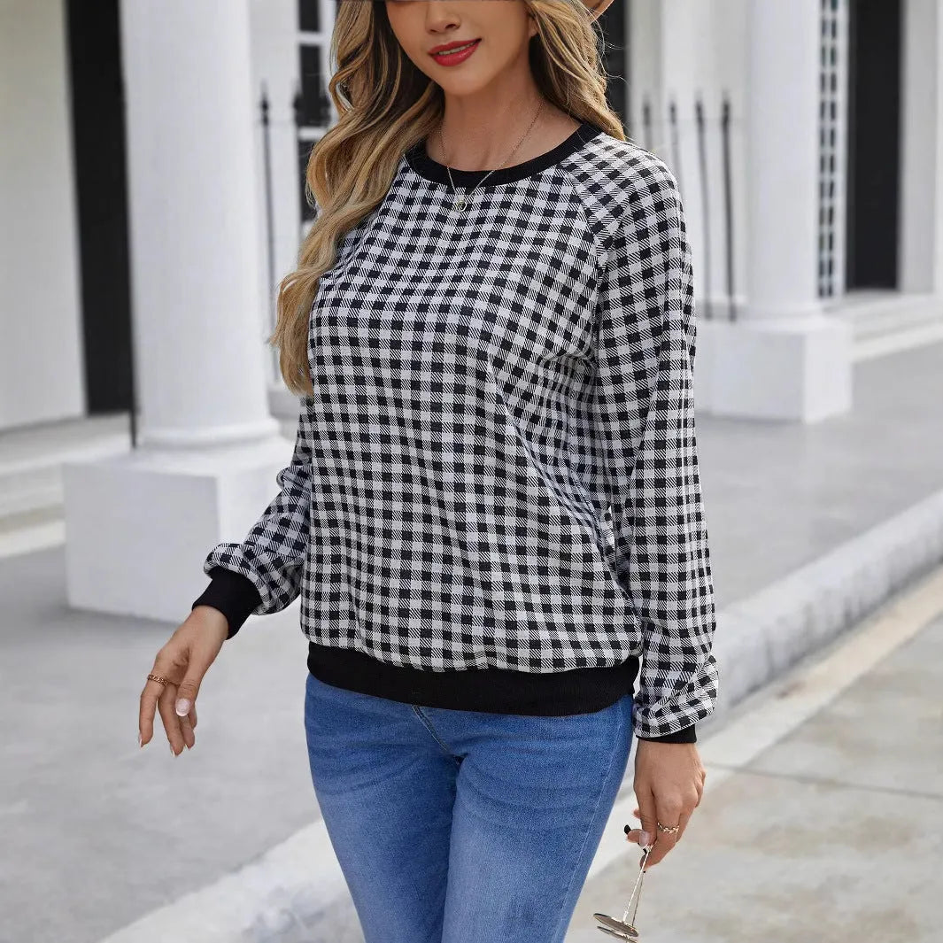 Black long sleeve pullover sweater with plaid and striped printed pattern
