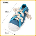 Plastic dog toy shaped like slippers in yellow, black, or blue, designed for chewing and making sound.