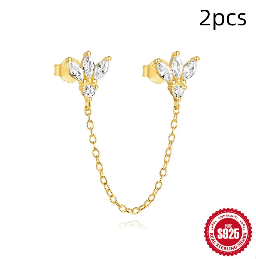 S925 sterling silver stud earring with golden double piercing design and zircon inlaid detail on a white background.