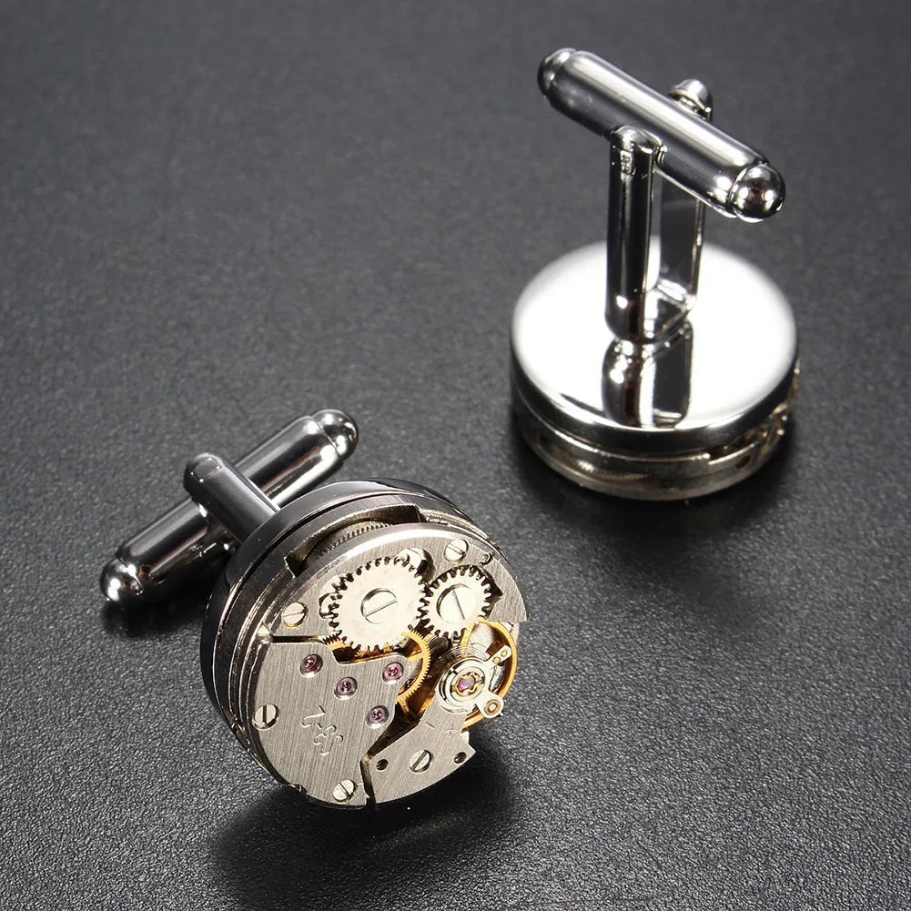 Silver geometric men's cufflinks with copper body and mechanical watch movement on dress shirt cuff