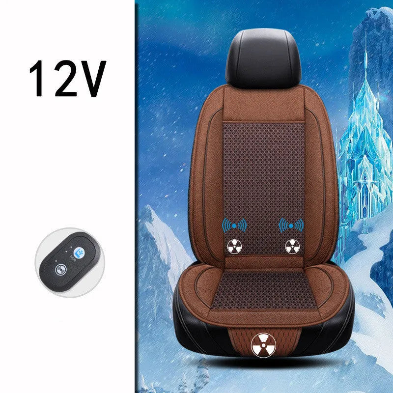 Black car ventilation seat cushion with power cord, shown on a car seat