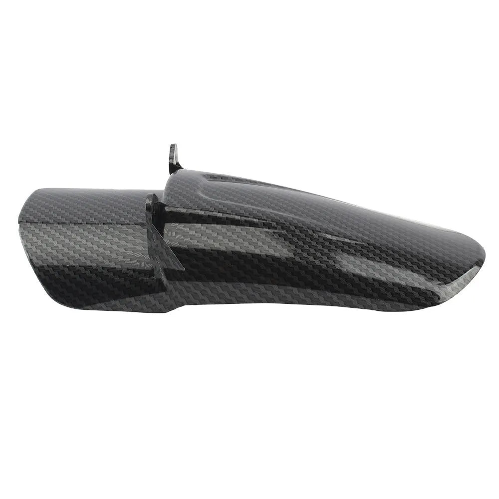 Carbon fibre rear shock absorber fender for a scrambling motorcycle.