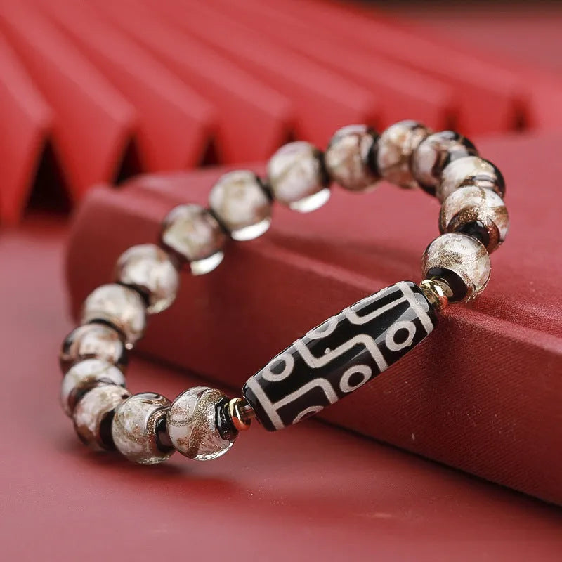 Chinese-style five-colour lucky snake bead bracelet made from coloured glaze, showing auspicious patterns.