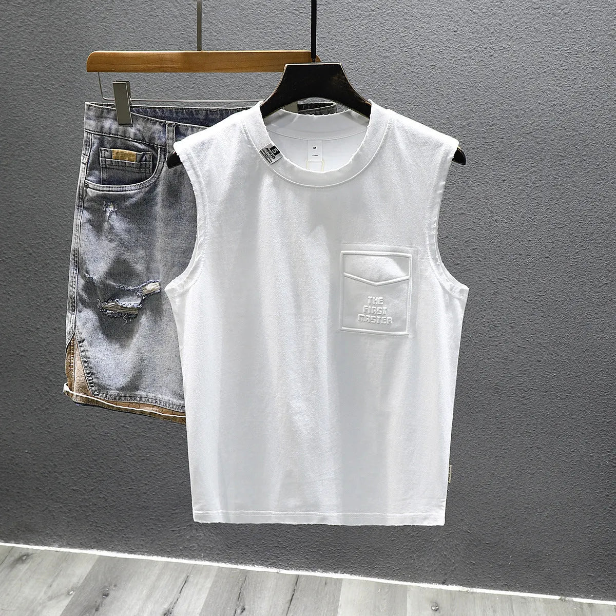 Men's solid colour cotton sleeveless t-shirt with loose fit design in black and white options