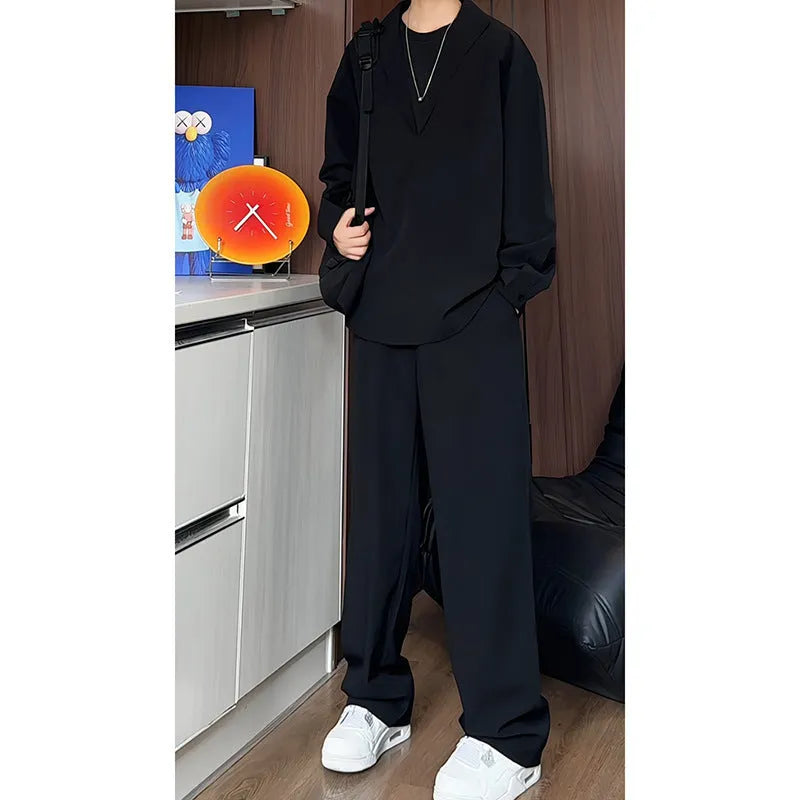 Men's black casual two-piece suit with long sleeve polo shirt and matching trousers in slim fit design