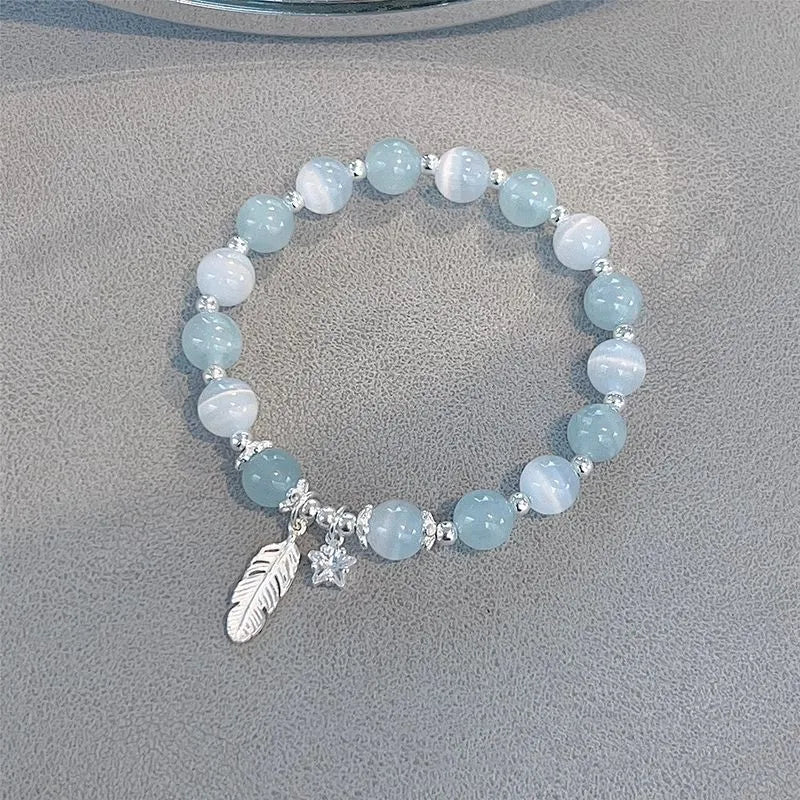 Small white crystal bracelet with eight star design in blue moonlight colour