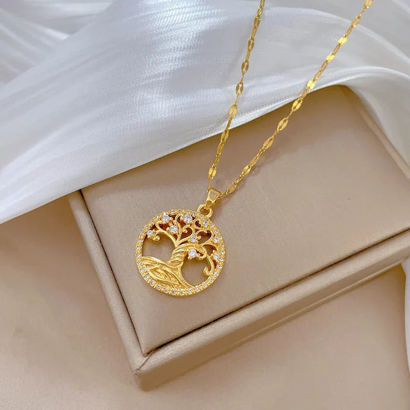 Gold-plated cross pendant necklace with micro-inlaid mother of pearl and rhinestone design on an adjustable chain.