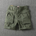 Men's straight-leg cotton cargo shorts in khaki with multiple pockets and stretch fabric.
