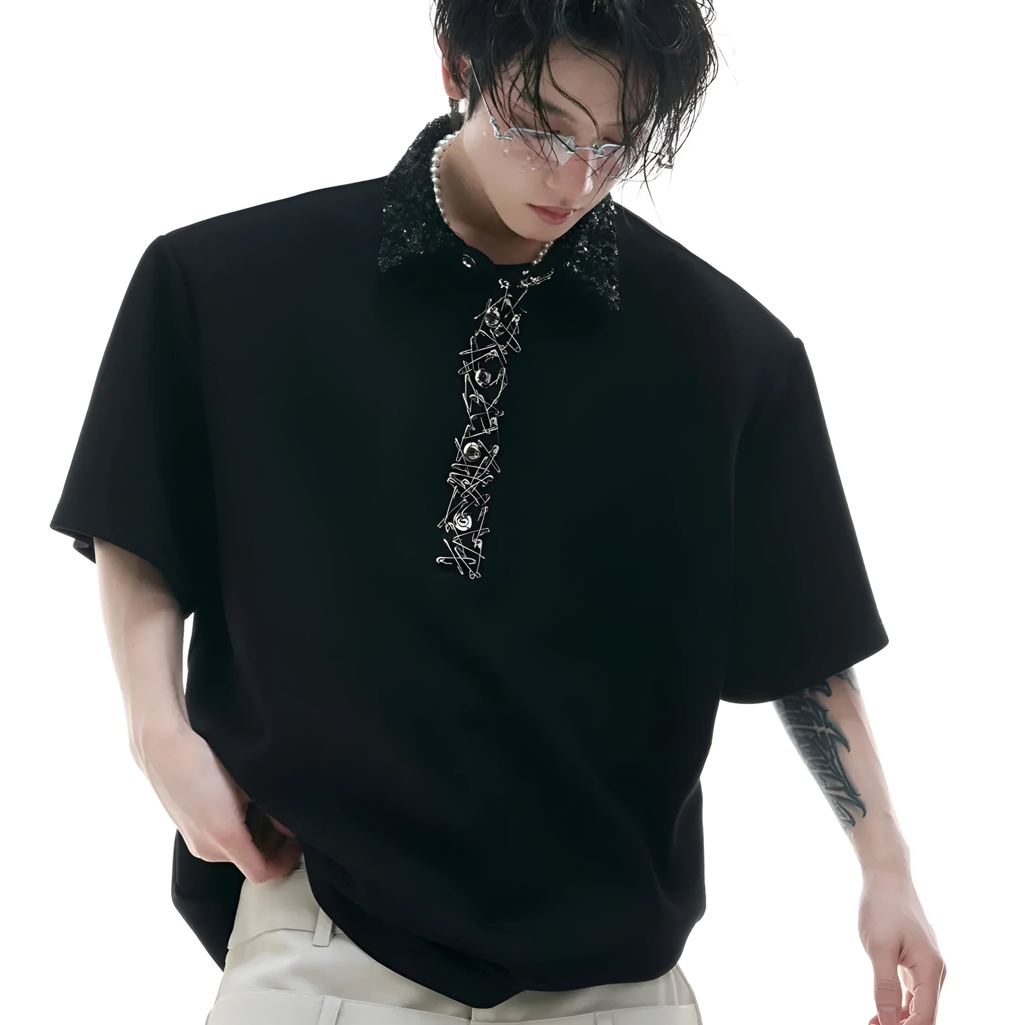Loose fit black sequined shirt with square neckline and short sleeves on a model