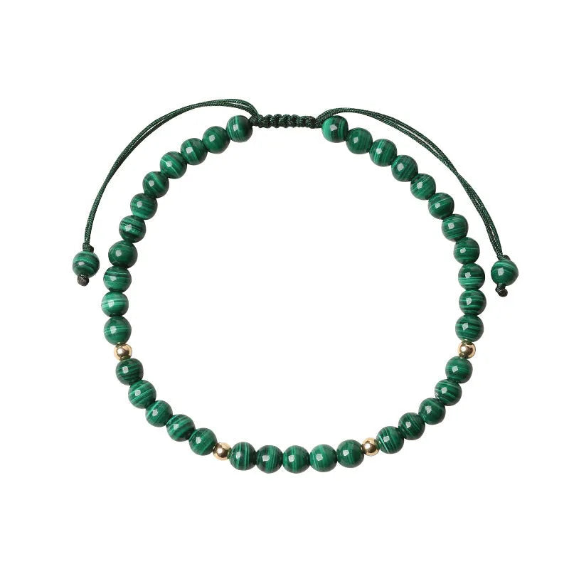Green malachite stone bracelet with golden beads on woven strap, zodiac animal motif.