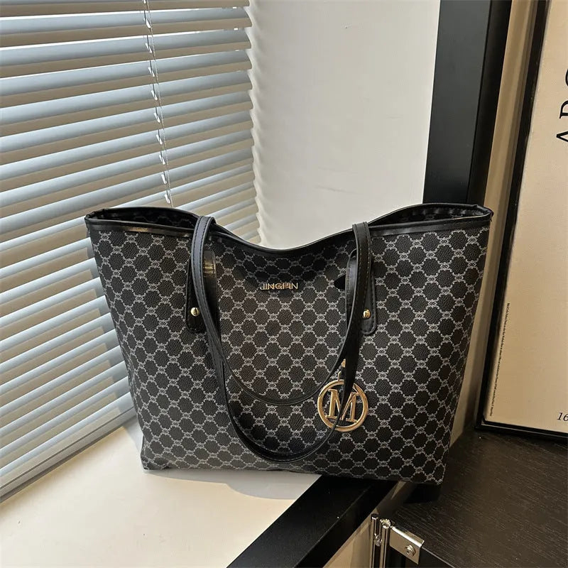 Women's structured PU leather shoulder bag in street-trend style with sewing thread detail.
