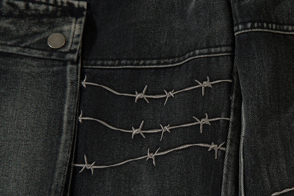 Black men's cotton wide-leg loose-fit trousers with embroidery on a mannequin.