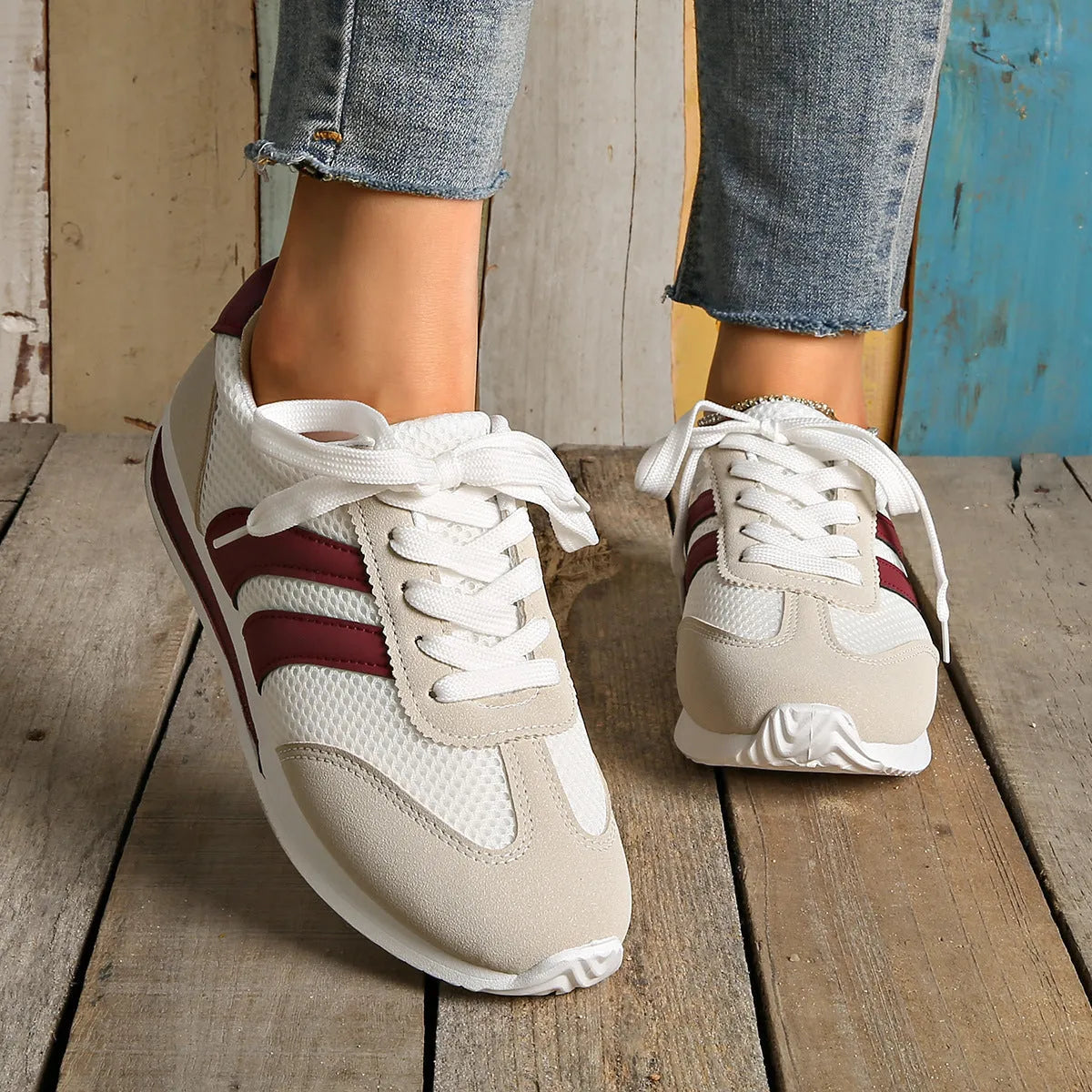 Women's wine red Cortez sneaker with cross-strap detail and breathable mesh upper