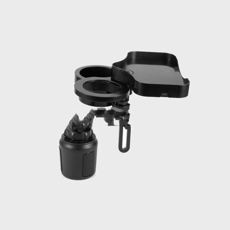 Black car cup holder with wireless charging pad and USB outlet, placed on a vehicle instrument panel.