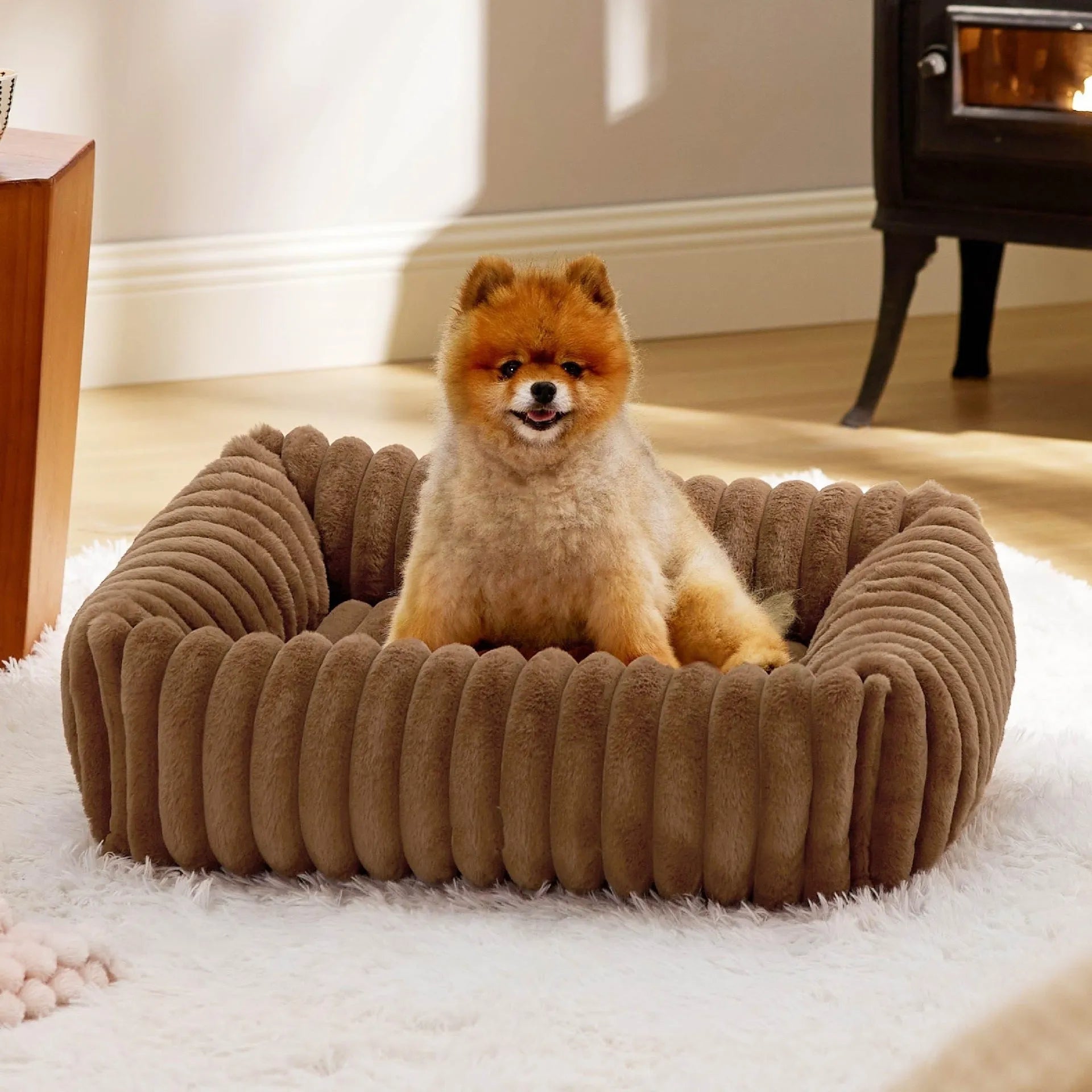 Rectangular orthopaedic dog bed with raised edges in beige colour showing high-density foam filling