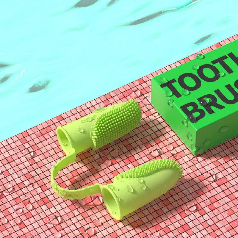 Close-up of blue green and pink silicone finger sleeves for pet dental cleaning on a hand.