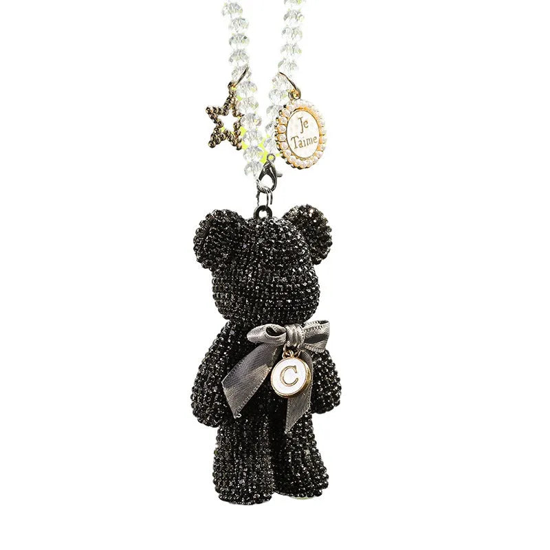 Crystal rhinestone Violent Bear car rearview mirror pendant in black, white, and mixed pastel colours.