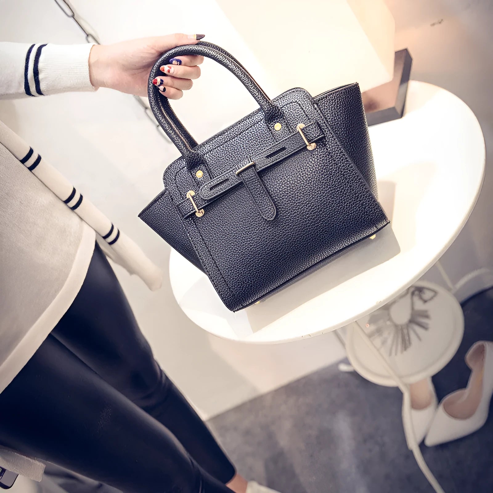 Women's black PU messenger bag with 120cm shoulder strap and zippered inner pocket