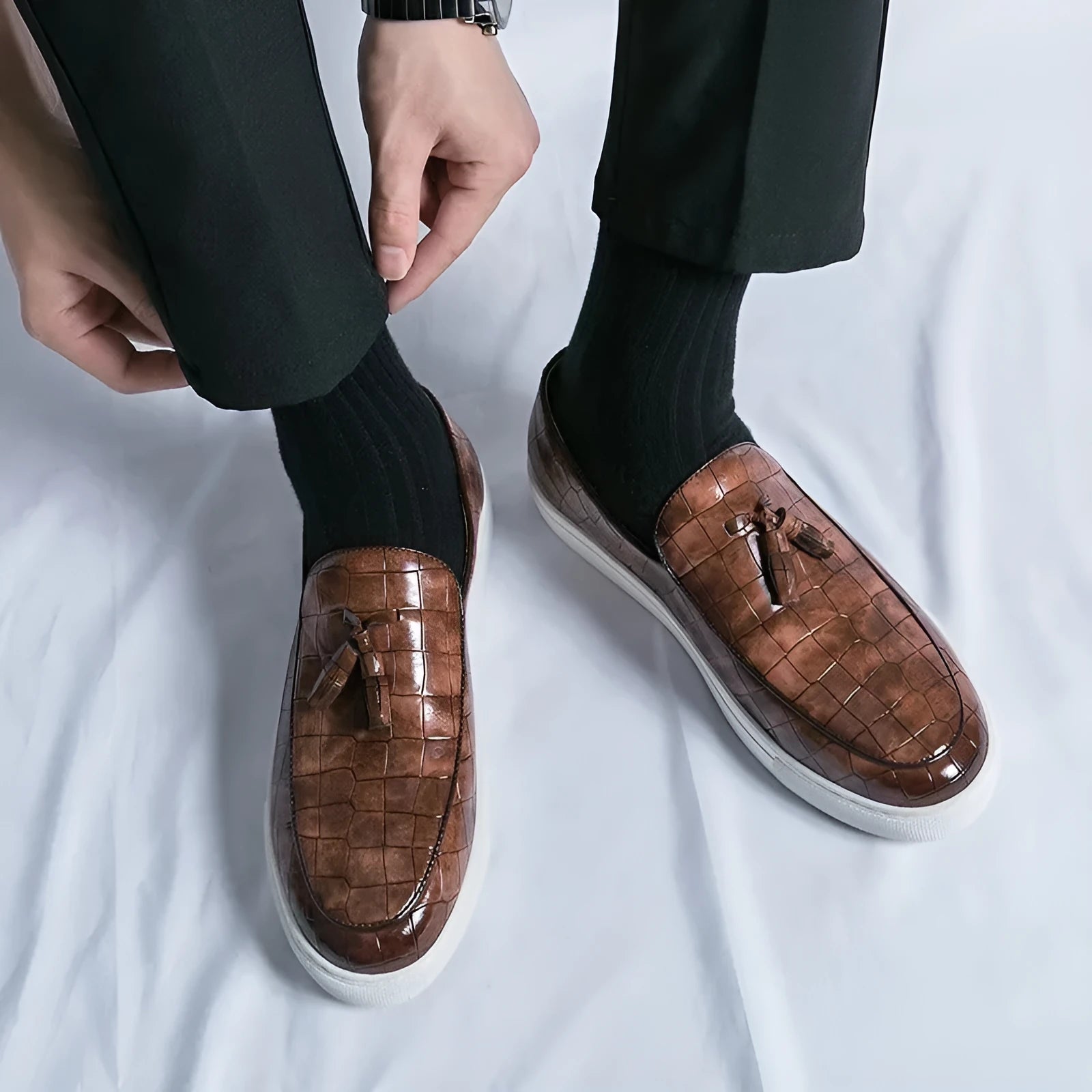 Men's brown plus size business casual sneakers with tassel detail on the PU leather upper and a rubber sole.