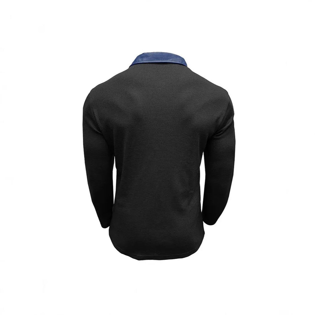Man wearing a dark green waffle-knit long-sleeved polo shirt with an asymmetric design detail.