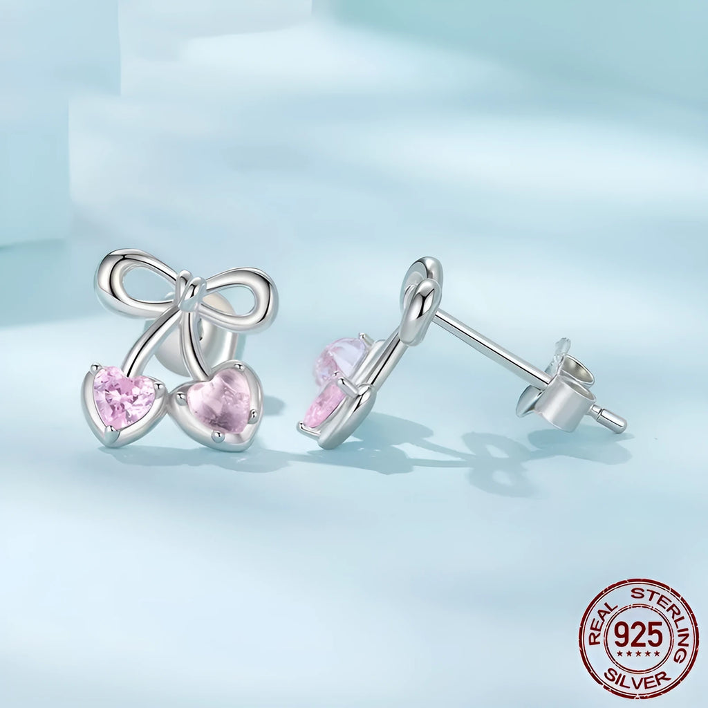 Sweet cherry stud earrings in 925 sterling silver with heart silhouette on light background