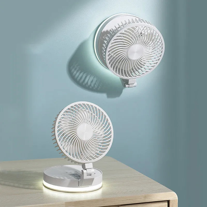 White folding USB rechargeable fan with 7 blades and remote control placed on a table
