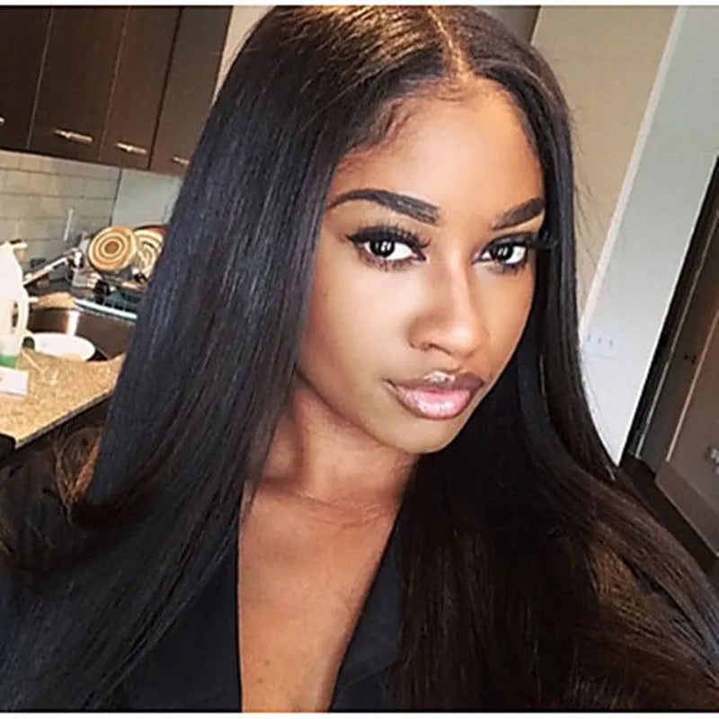 Long straight black synthetic wig with centre-parted bangs on display