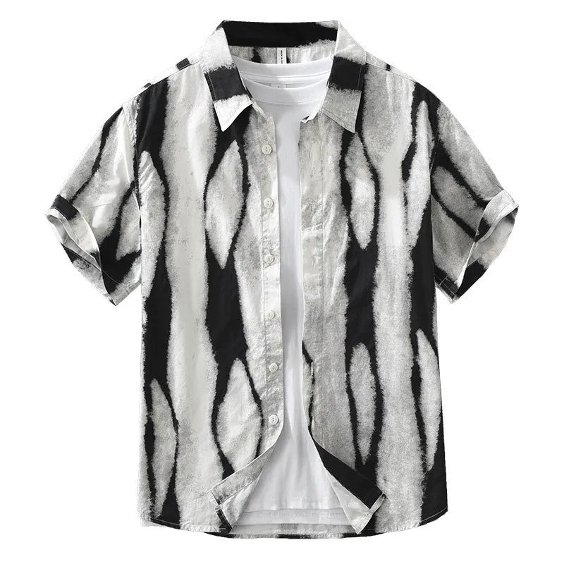 Man wearing a black and white striped retro-style short sleeve cotton shirt with a loose fit.