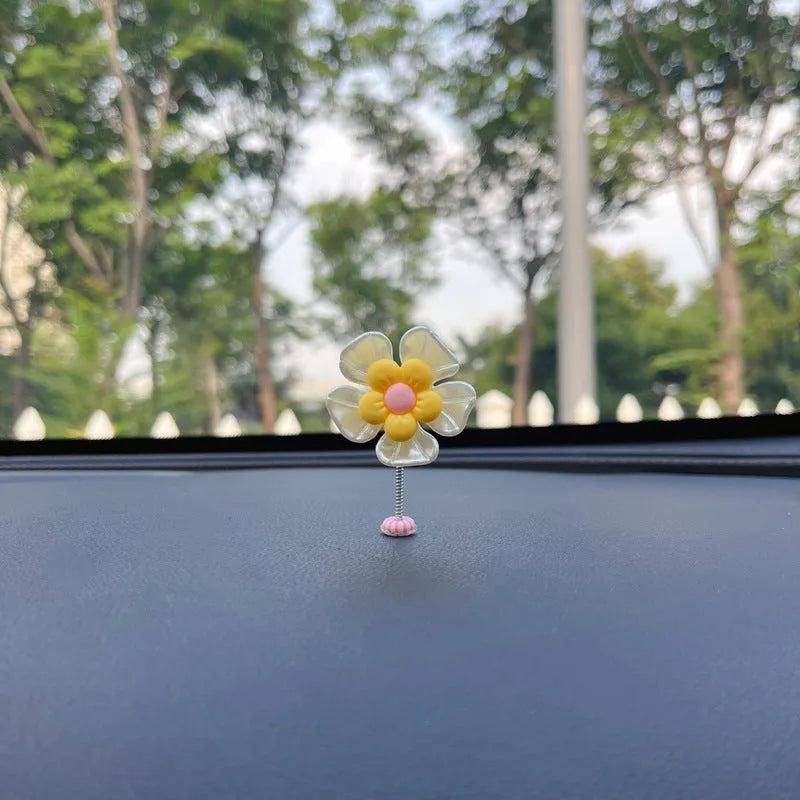 Cute plastic swing car decoration in blue, showing approximate 5cm height.