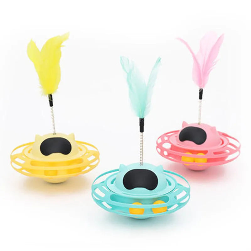 Pink cat tumbler turntable toy with rotating platform and dangling cat stick for interactive feline play