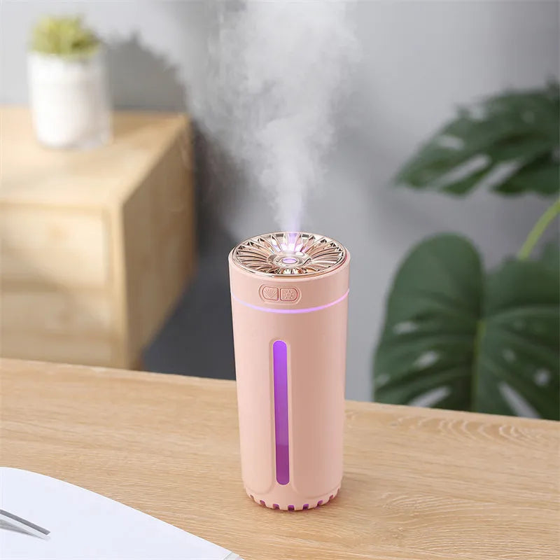 Portable black USB humidifier with colourful lights on car cup holder