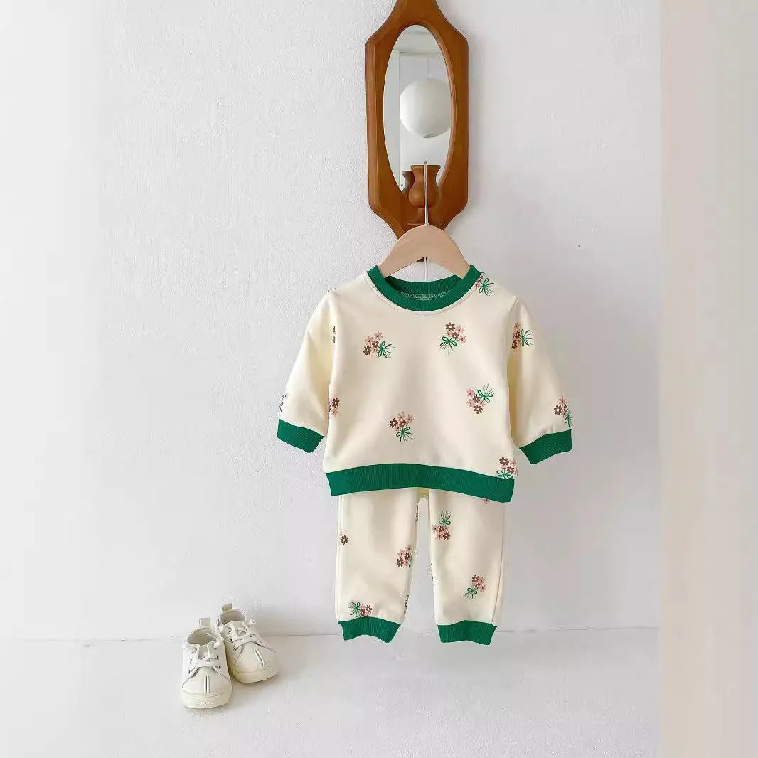 Baby cotton suit set in green with long sleeves and pants, front view