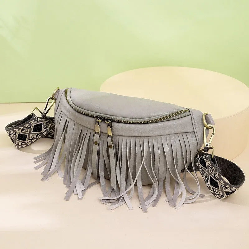 Retro-style pleated messenger crossbody bag in PU leather with a tassel, shown in macaron-gray.