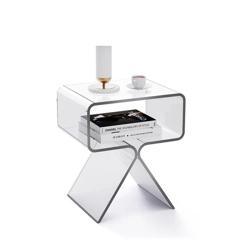 Minimalist acrylic side table in transparent black, 39x30x45cm, beside a sofa in a living room