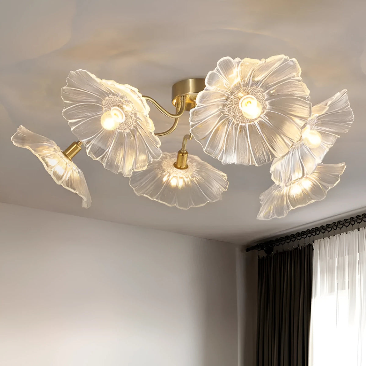 Simple modern ceiling flower lamp with white flowers and 5 heads emitting warm light in a living room